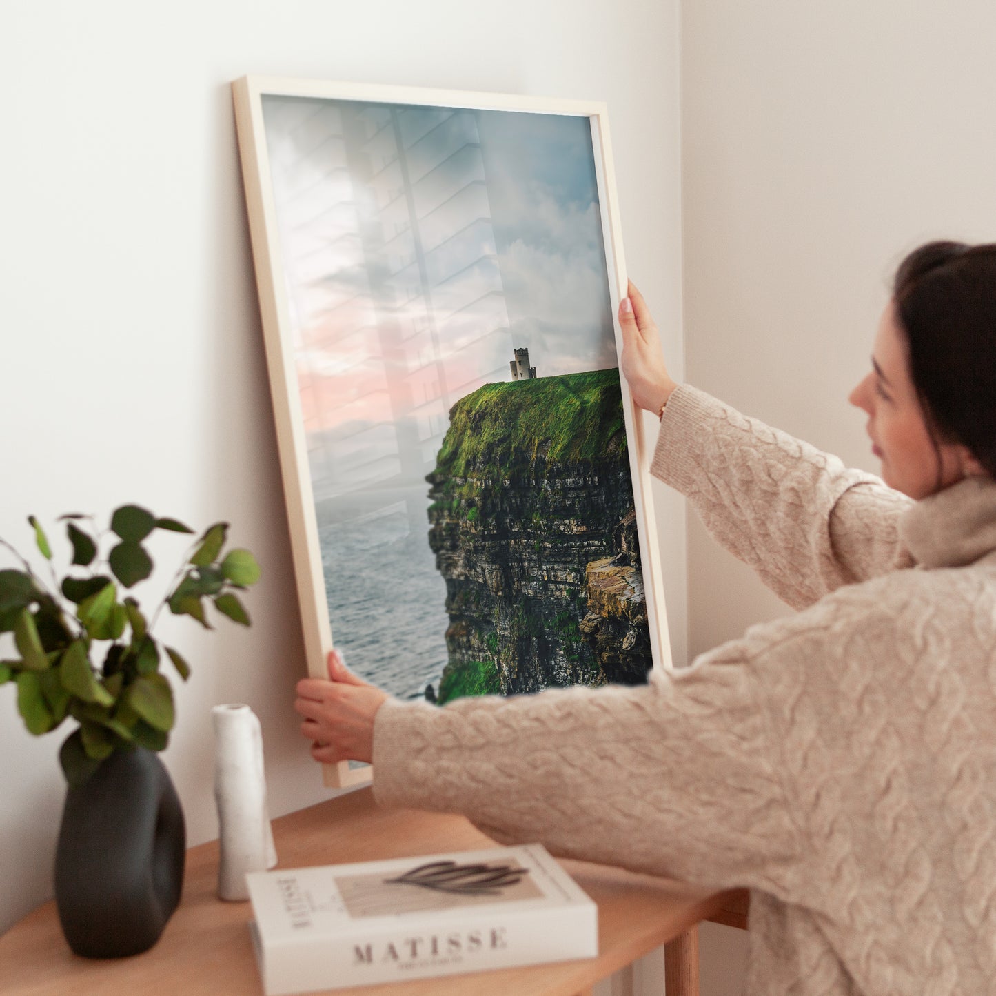 Black and gold frame with photo of the Cliffs of Moher and O’Brien’s Tower above the Atlantic