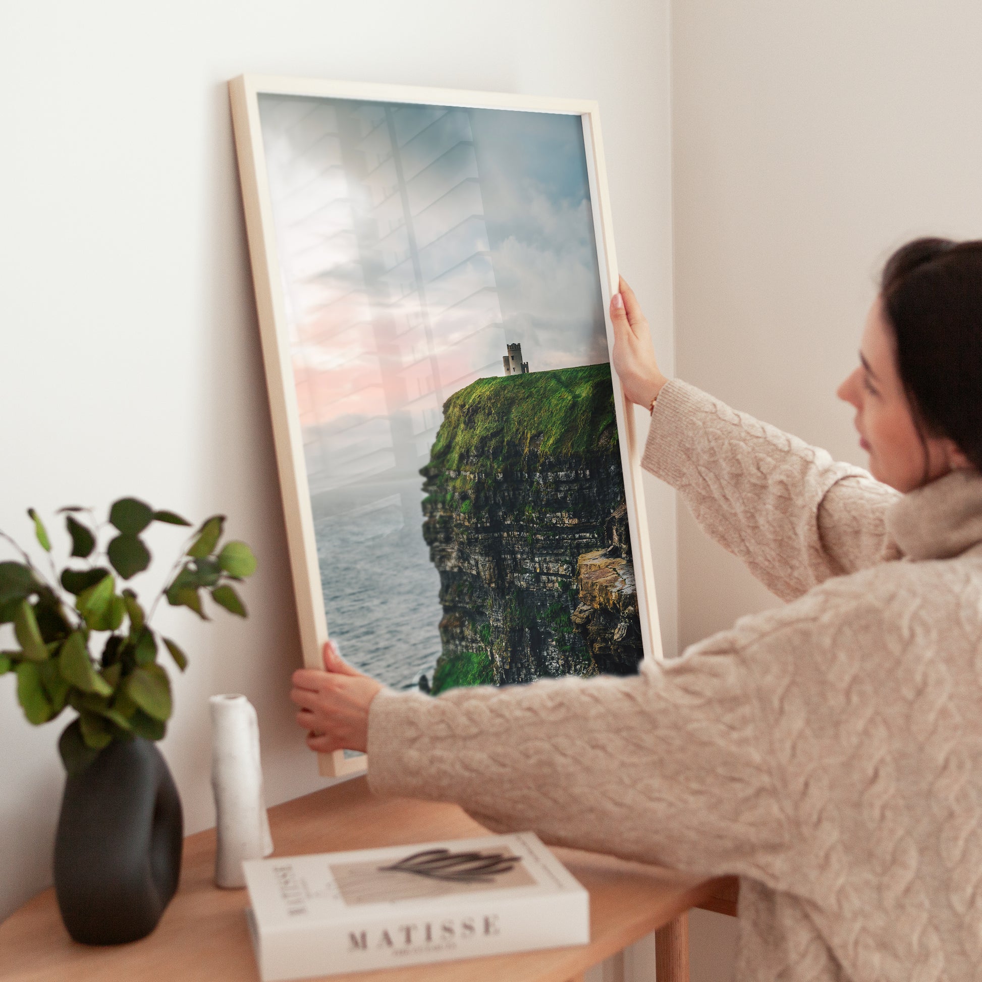 Black and gold frame with photo of the Cliffs of Moher and O’Brien’s Tower above the Atlantic
