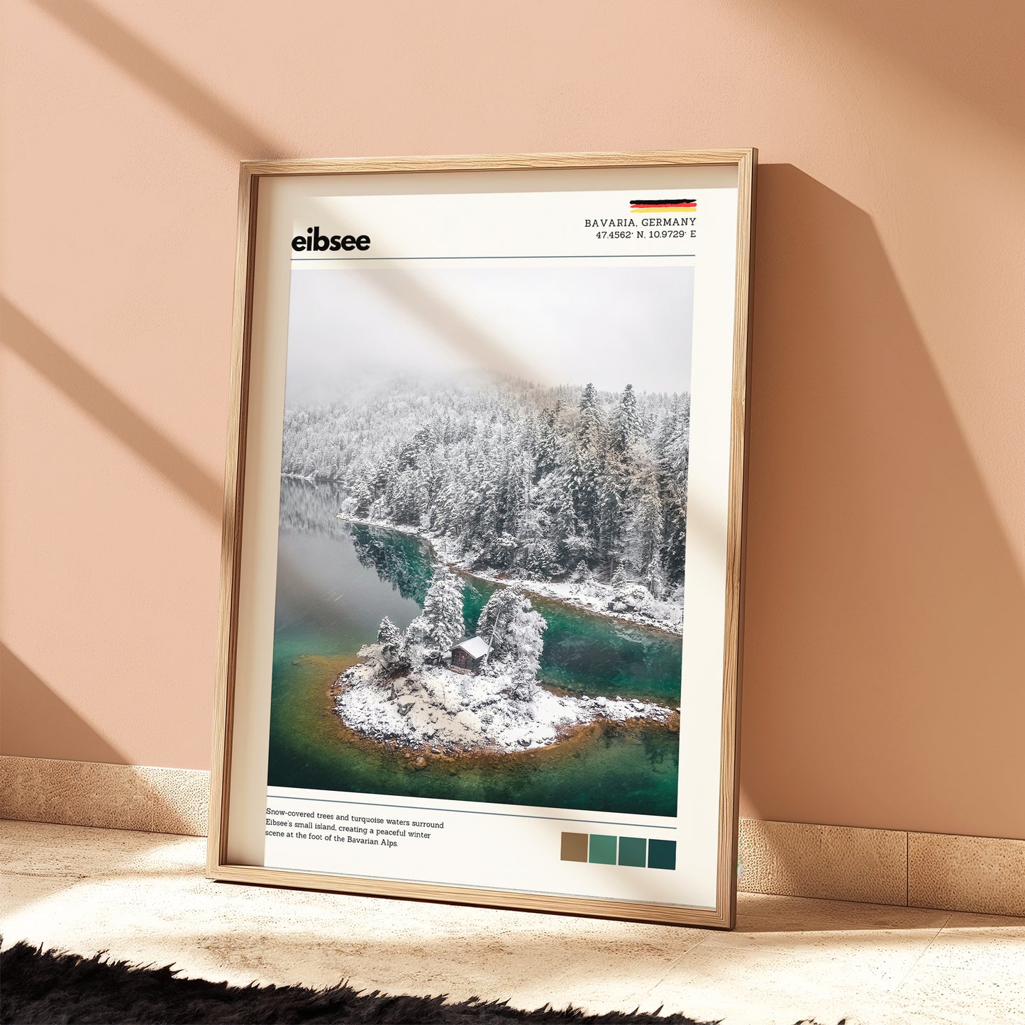Eibsee winter island cabin Bavaria Germany aerial photography print in natural wood frame leaning against warm terracotta wall on textured floor