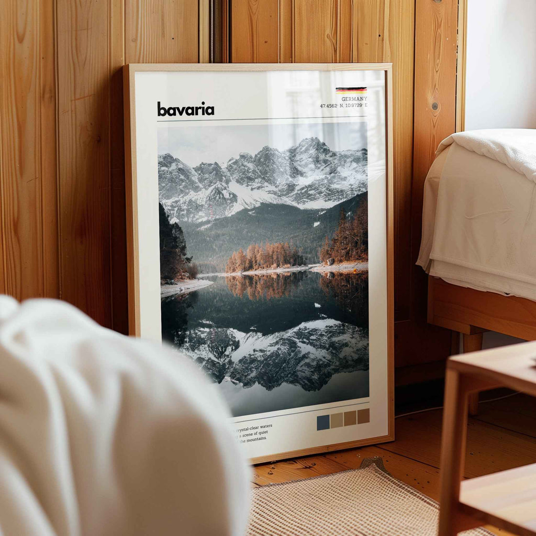 Framed Eibsee Zugspitze Bavaria Germany lake reflection print in natural wood frame leaning against pine panelled bedroom wall