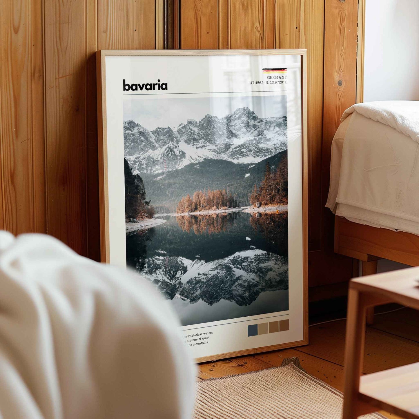 Framed Eibsee Zugspitze Bavaria Germany lake reflection print in natural wood frame leaning against pine panelled bedroom wall