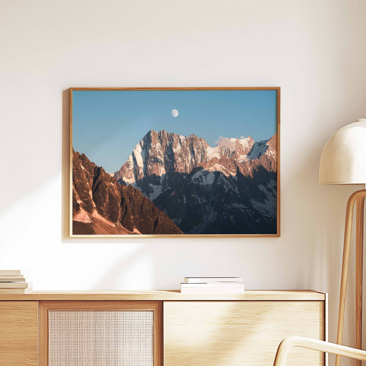 Grandes Jorasses moonrise print in wooden frame on a contemporary bedroom wall