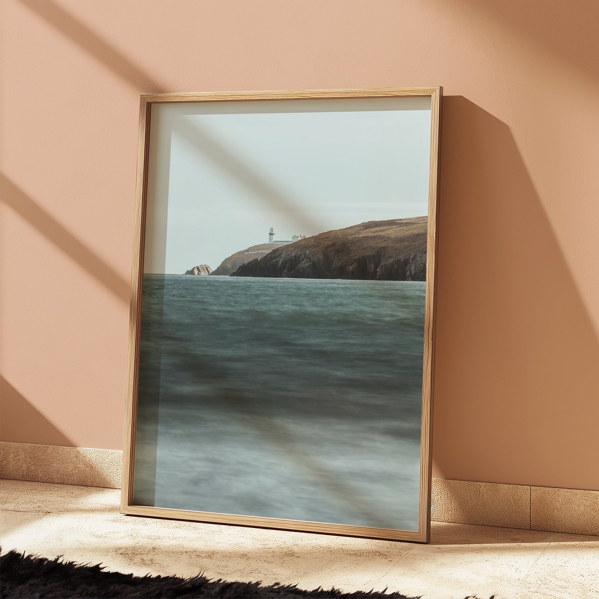 Galley Head Lighthouse wall print with golden cliffs and soft ocean tones