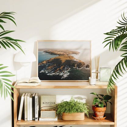  Irish lighthouse seascape print surrounded by plants and books