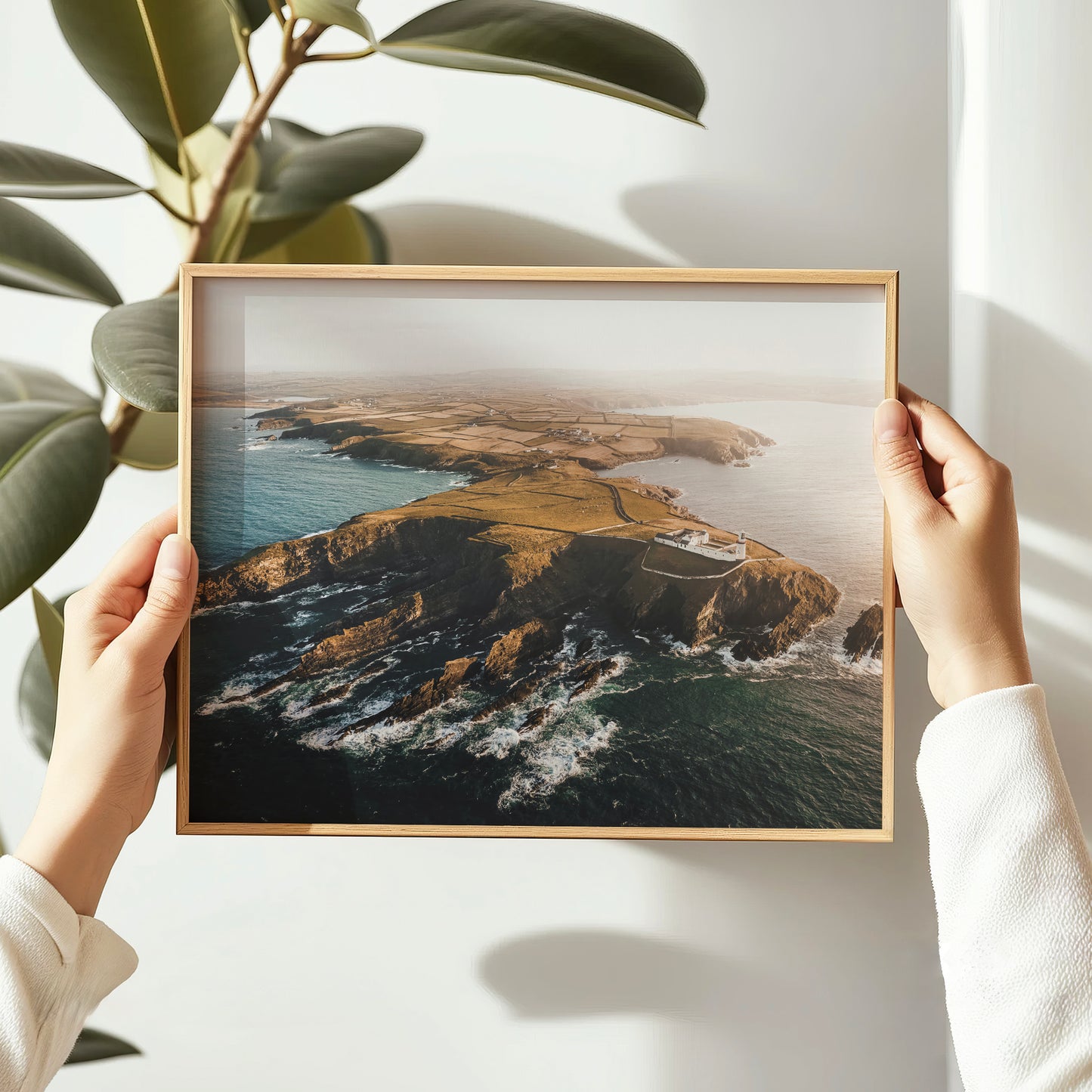 galley-head-lighthouse-print-held-in-hands-coastal-ireland-art