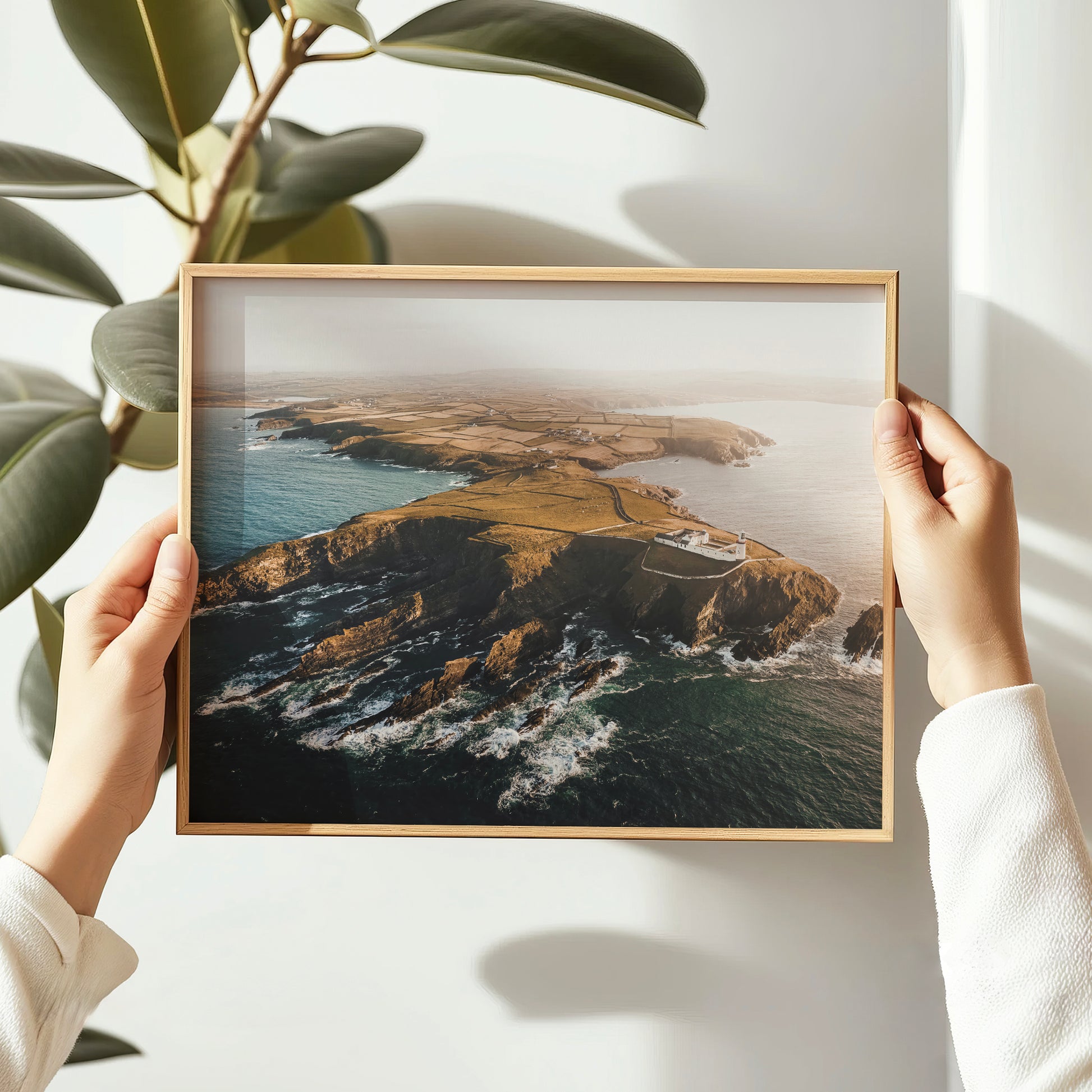 galley-head-lighthouse-print-held-in-hands-coastal-ireland-art