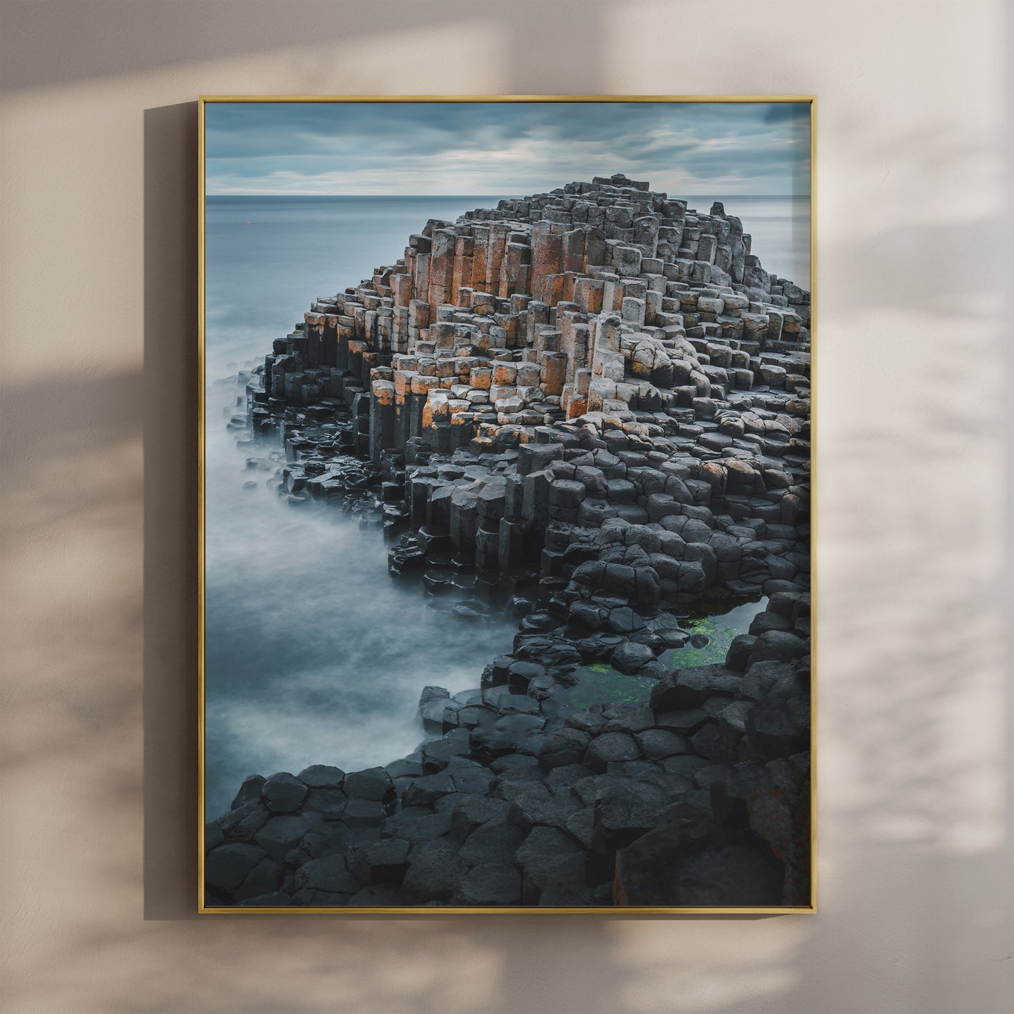 Fine art print of the Giant's Causeway with hexagonal basalt columns and ocean backdrop