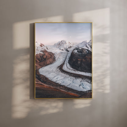 Golden hour view of Gorner Glacier with surrounding snow-capped peaks in the Swiss Alps.