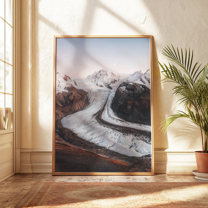 Aerial view of Gorner Glacier with its iconic curving ice formations and rocky landscape.