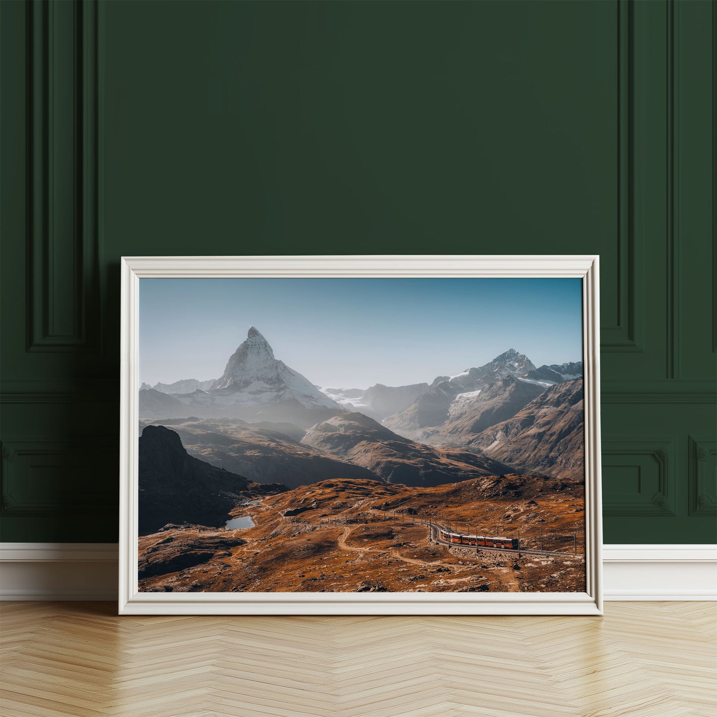 Alpine scenery of Gornergrat featuring the Matterhorn and a picturesque train route in morning light