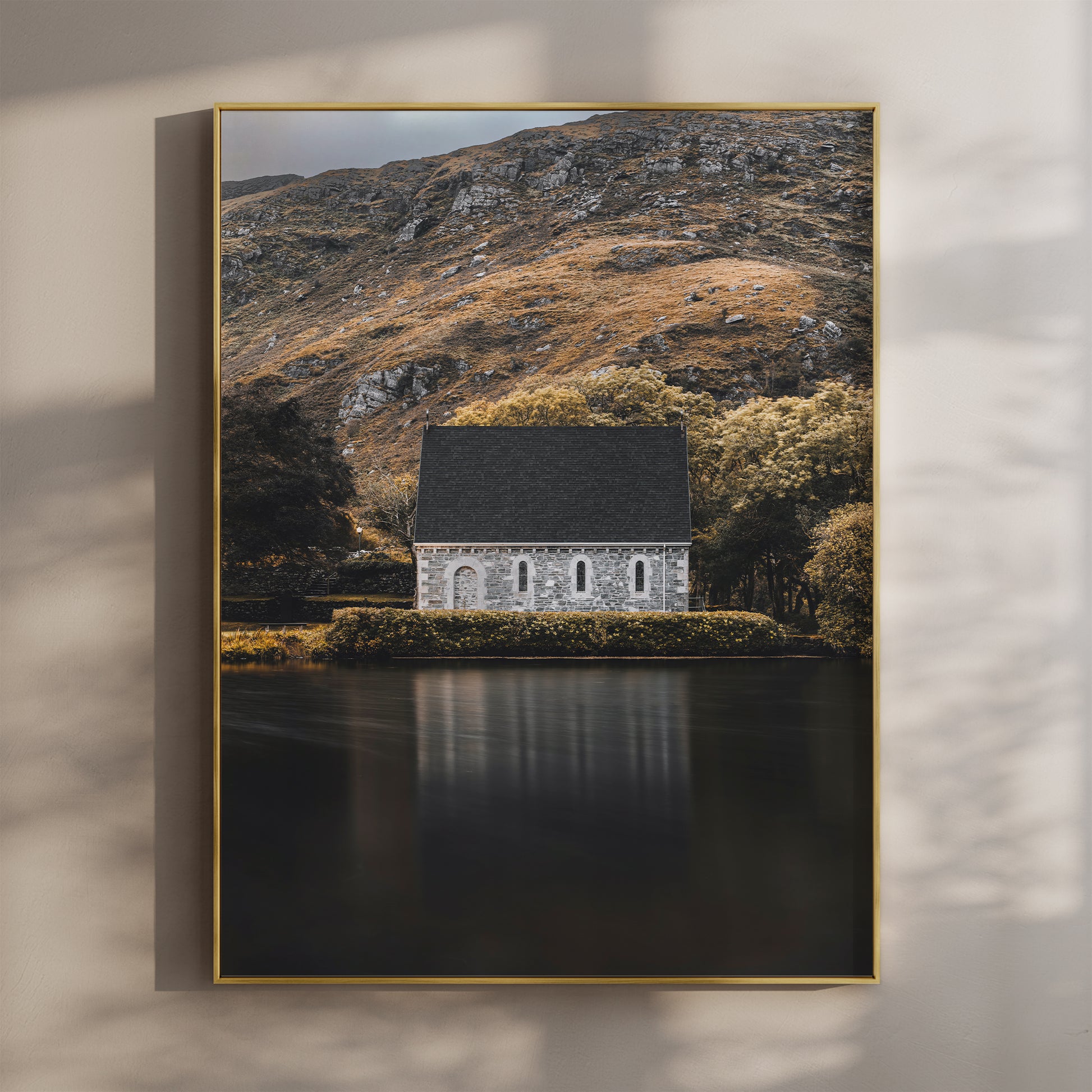 Framed wall art print of Gougane Barra chapel by a lake with mountain backdrop
