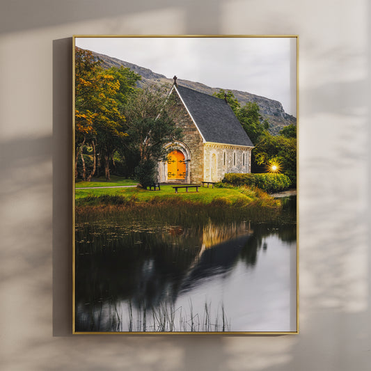 Framed wall art print of Gougane Barra church glowing at golden hour