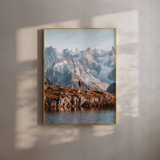 Wall art print of a hiker on the Tour du Mont Blanc trail with majestic alpine mountains in the background.