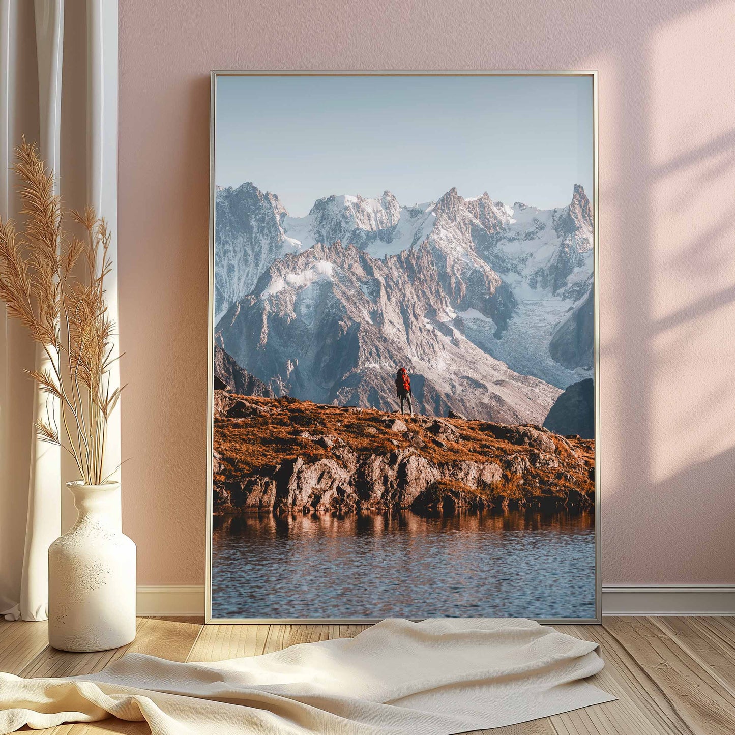 Framed wall art of a hiker on the Tour du Mont Blanc, showcasing alpine scenery.