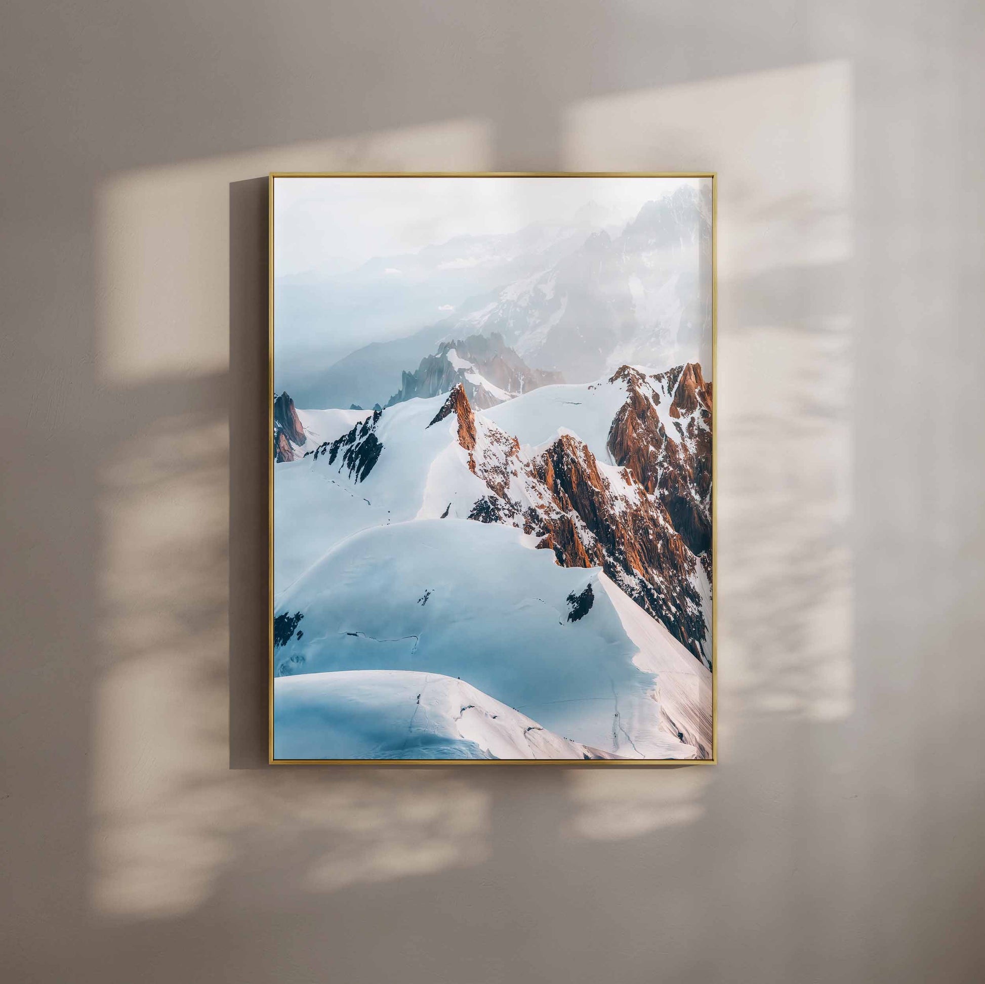 Stunning aerial view of hikers on the Trois Monts route to the Mont Blanc summit, showcasing dramatic alpine peaks and glaciers.