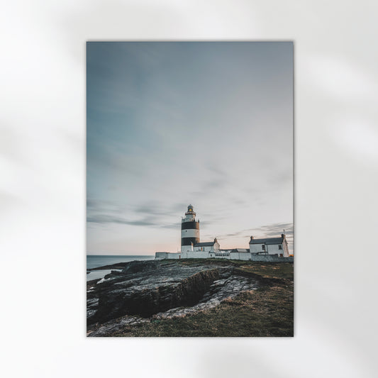 Long exposure photo of Hook Head Lighthouse at sunset with ocean view