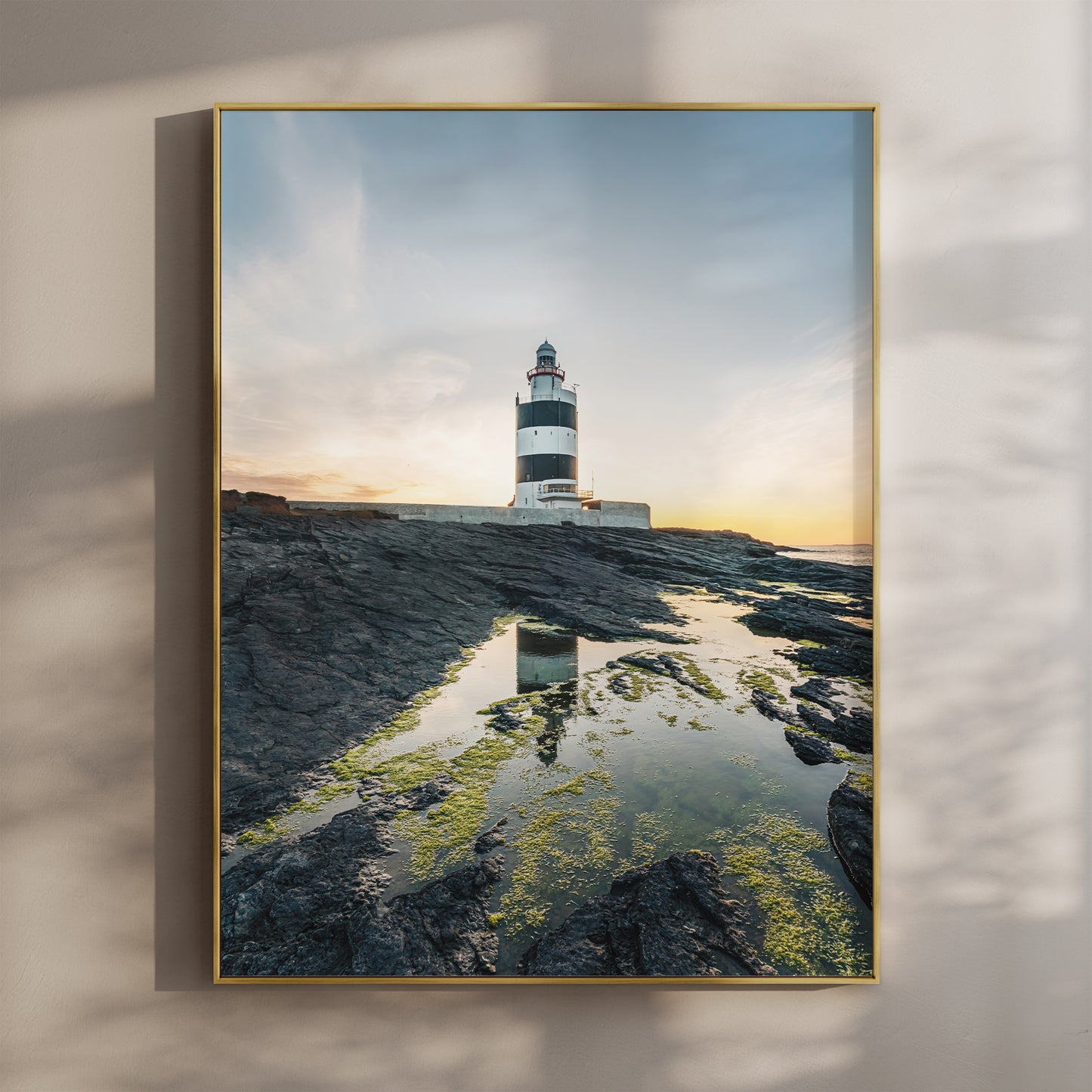 Hook Head Lighthouse at sunset with soft blue sky and golden light, coastal Irish wall art print