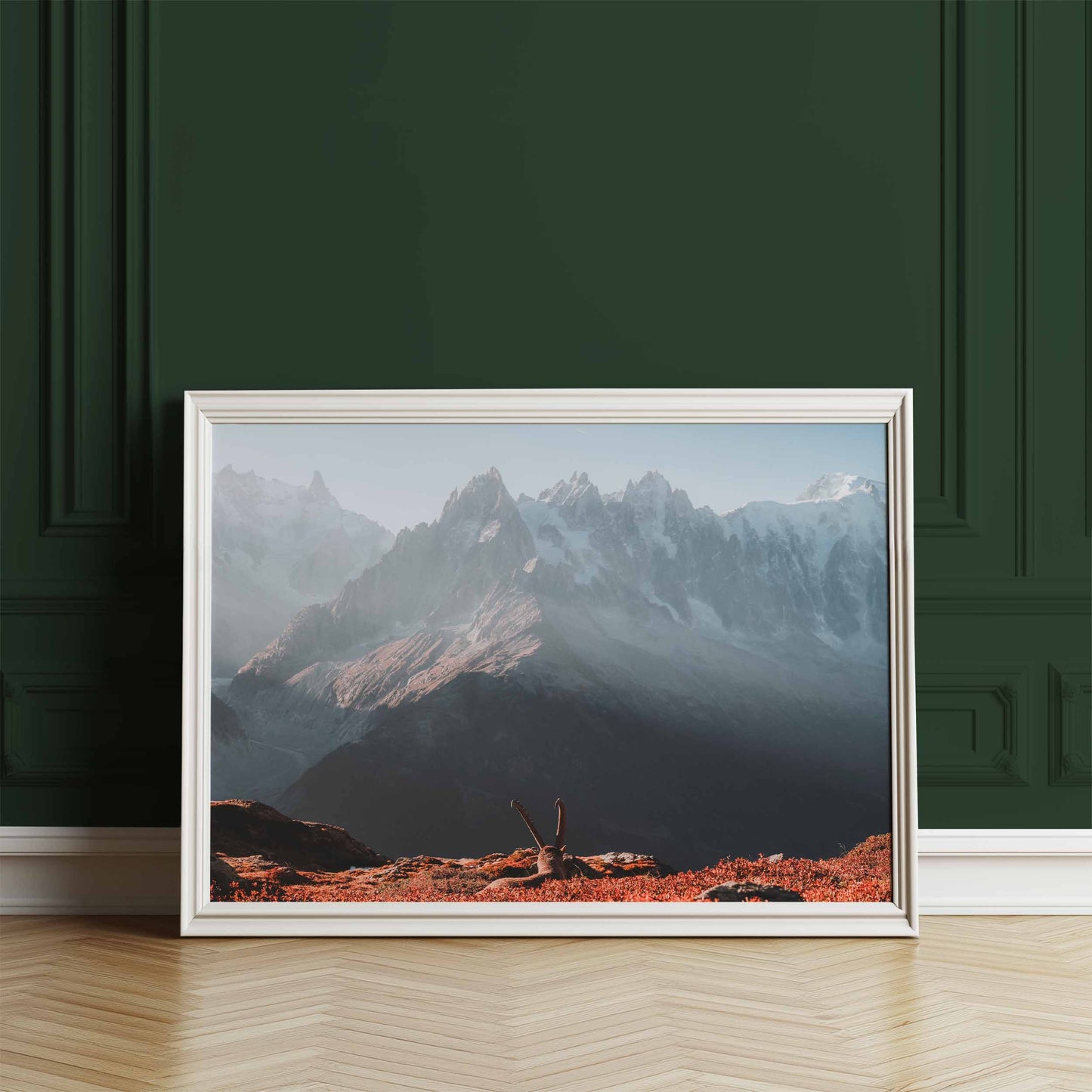 Ibex standing proudly at sunrise with Mont Blanc backdrop, showcased on a wooden console.