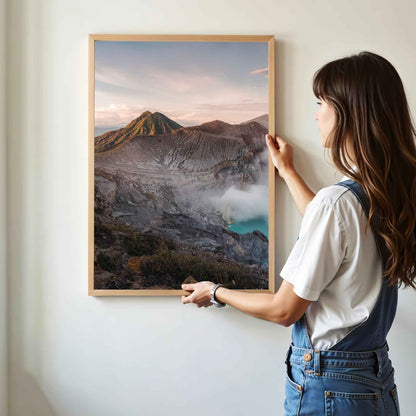 Woman hanging Ijen volcano crater lake Java Indonesia framed wall art print in natural oak wood frame on white wall