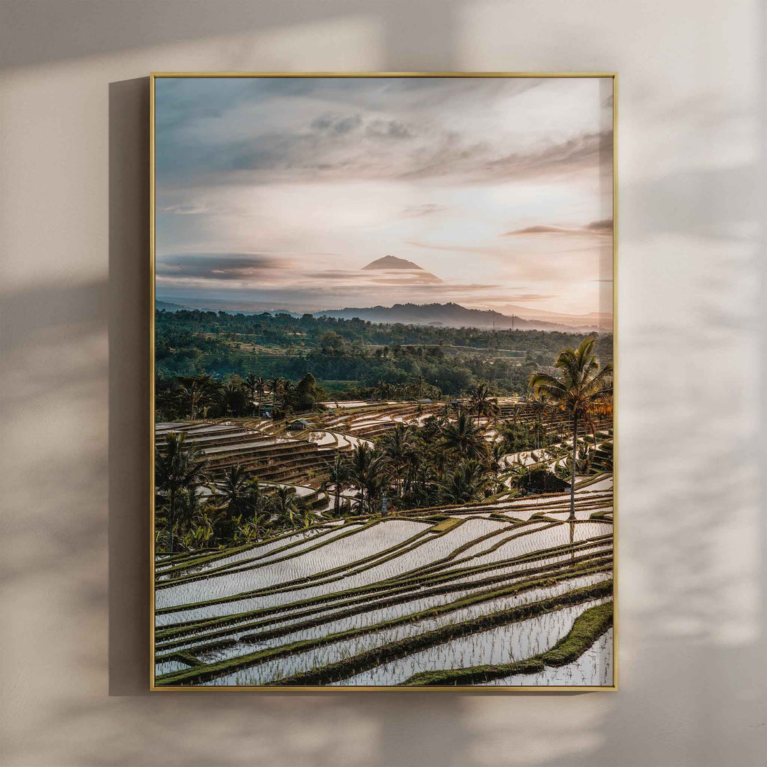 Jatiluwih rice terraces Bali wall art print with Mount Agung at sunset in gold floating frame mounted on beige wall with natural shadows