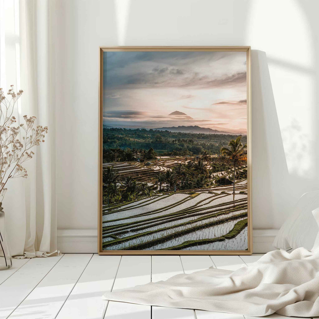Jatiluwih rice terraces Bali large framed wall art print in natural wood frame leaning against white wall with dried flowers