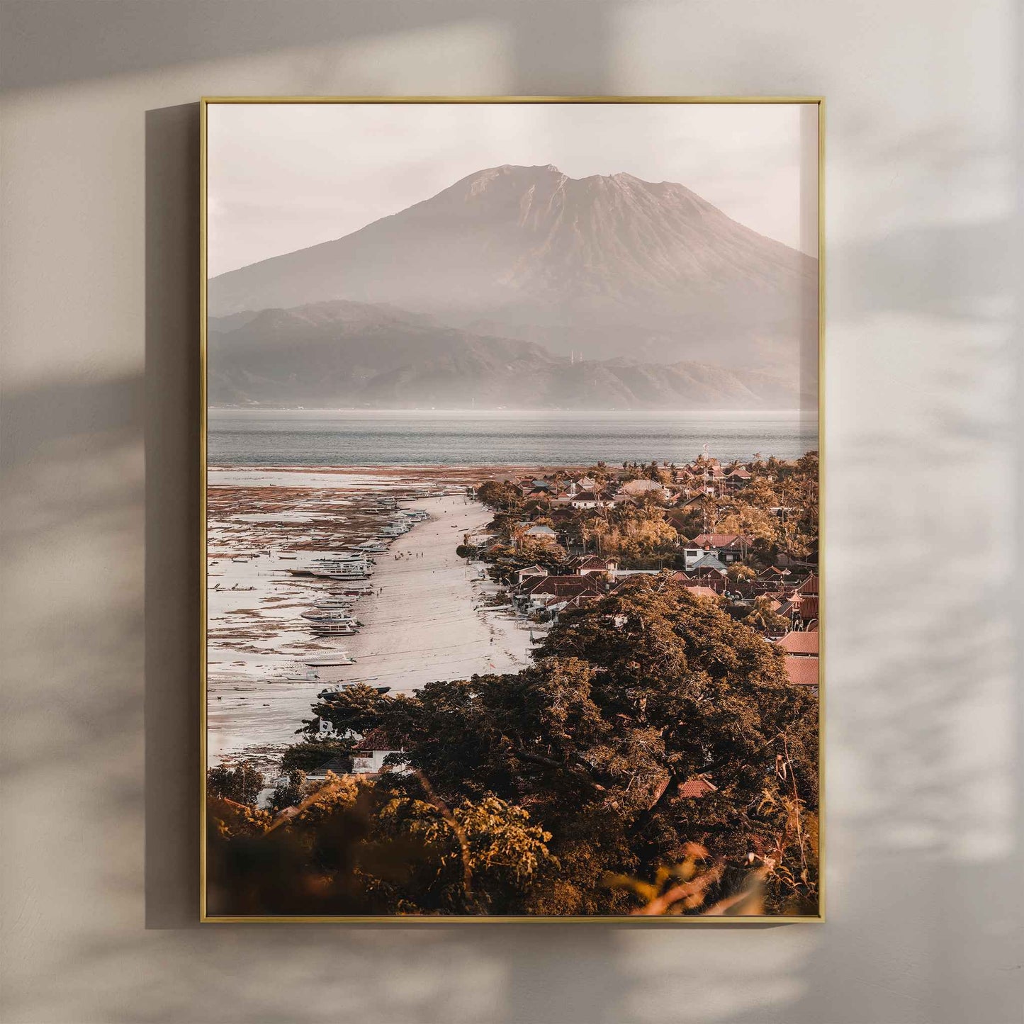 Jungutbatu Beach Nusa Lembongan wall art print with Mount Agung in gold floating frame mounted on beige wall with natural shadows