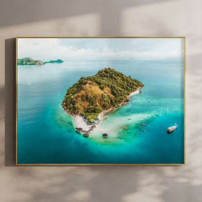 Framed aerial print of Kelor Island Komodo in a gold float frame mounted on a wall