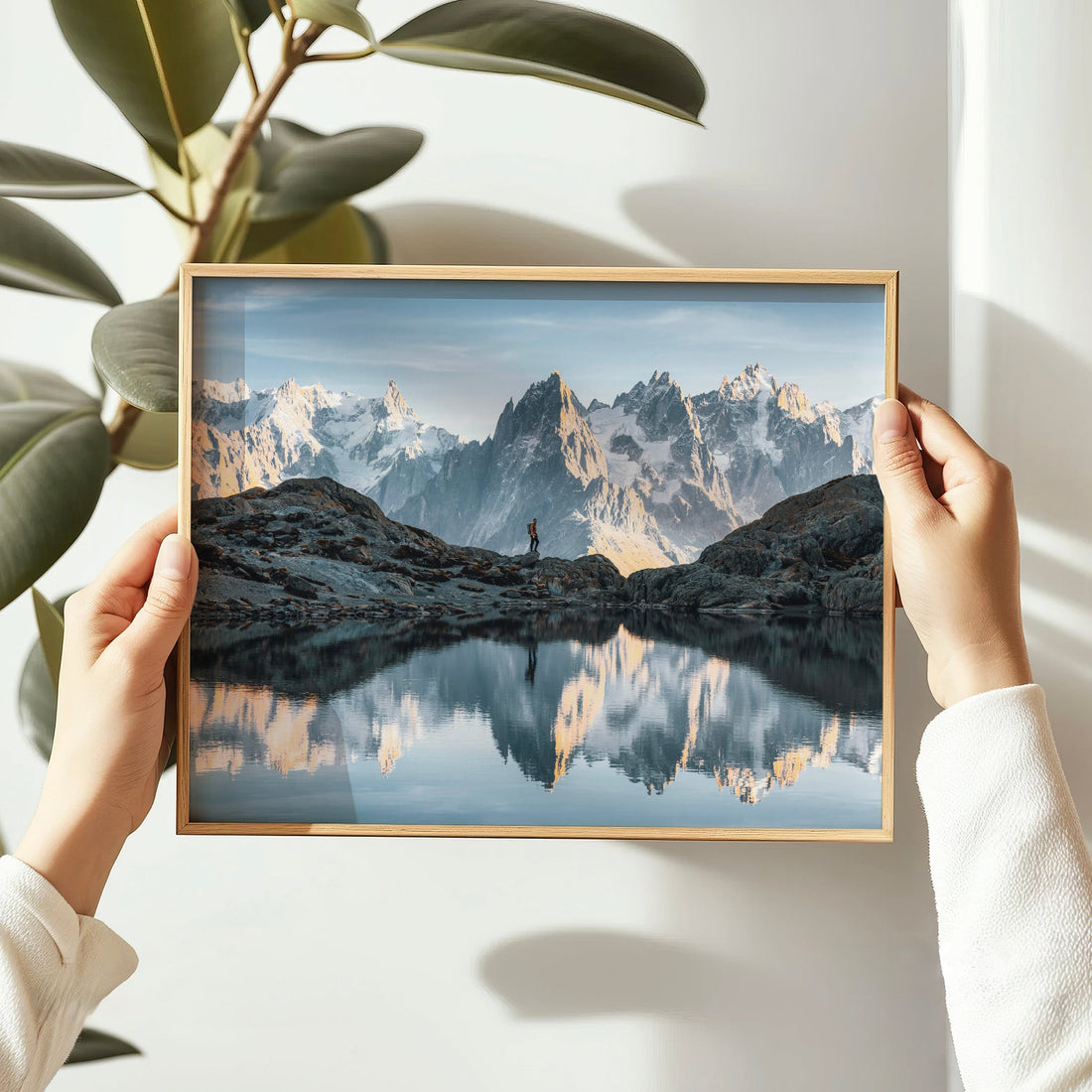 Lac Blanc landscape photography featuring a solo hiker and panoramic Mont Blanc mountain range.