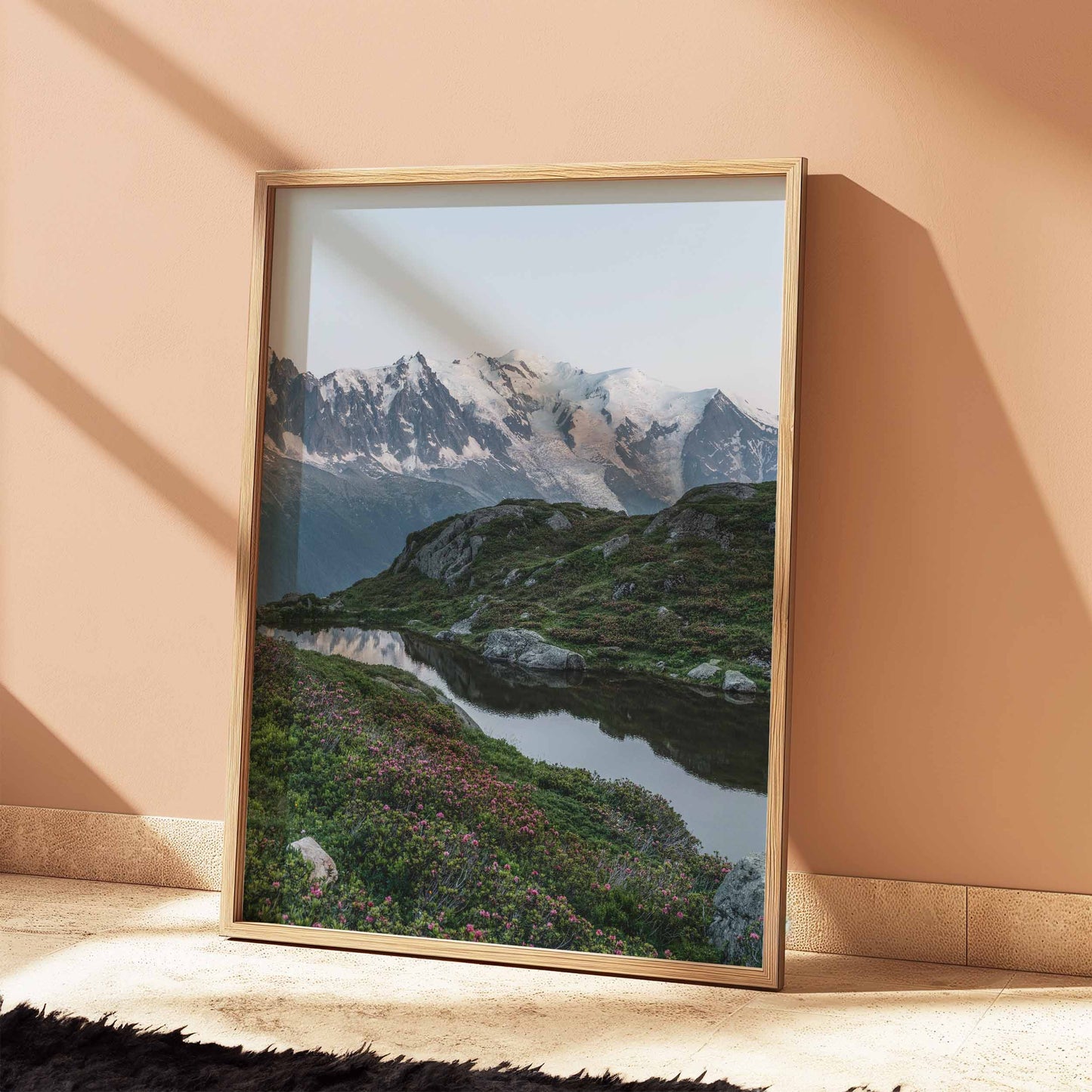 Captivating view of Lac de la Flégère with Mont Blanc reflections and wildflower meadows.