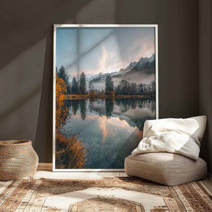 Lac des Gaillands during autumn sunrise, serene lake reflections with snowy peaks, displayed in a white frame.