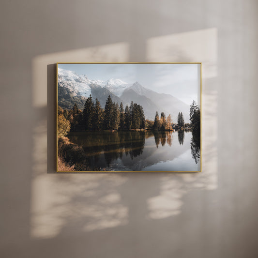 Framed wall art print of Lac des Gaillands in Chamonix with mountain reflections and golden light.