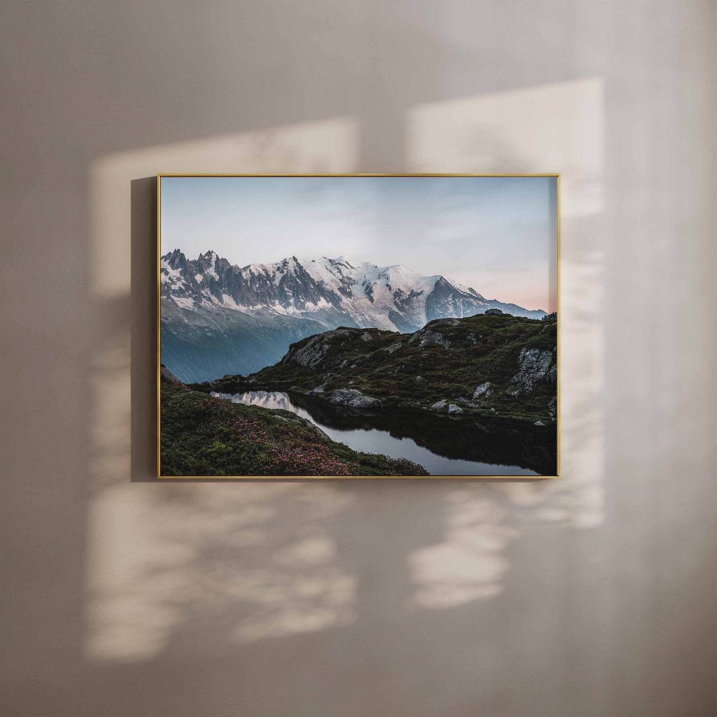 Wall art print of Lac de la Flégère in Chamonix with Mont Blanc in the background, displayed in a gold frame.