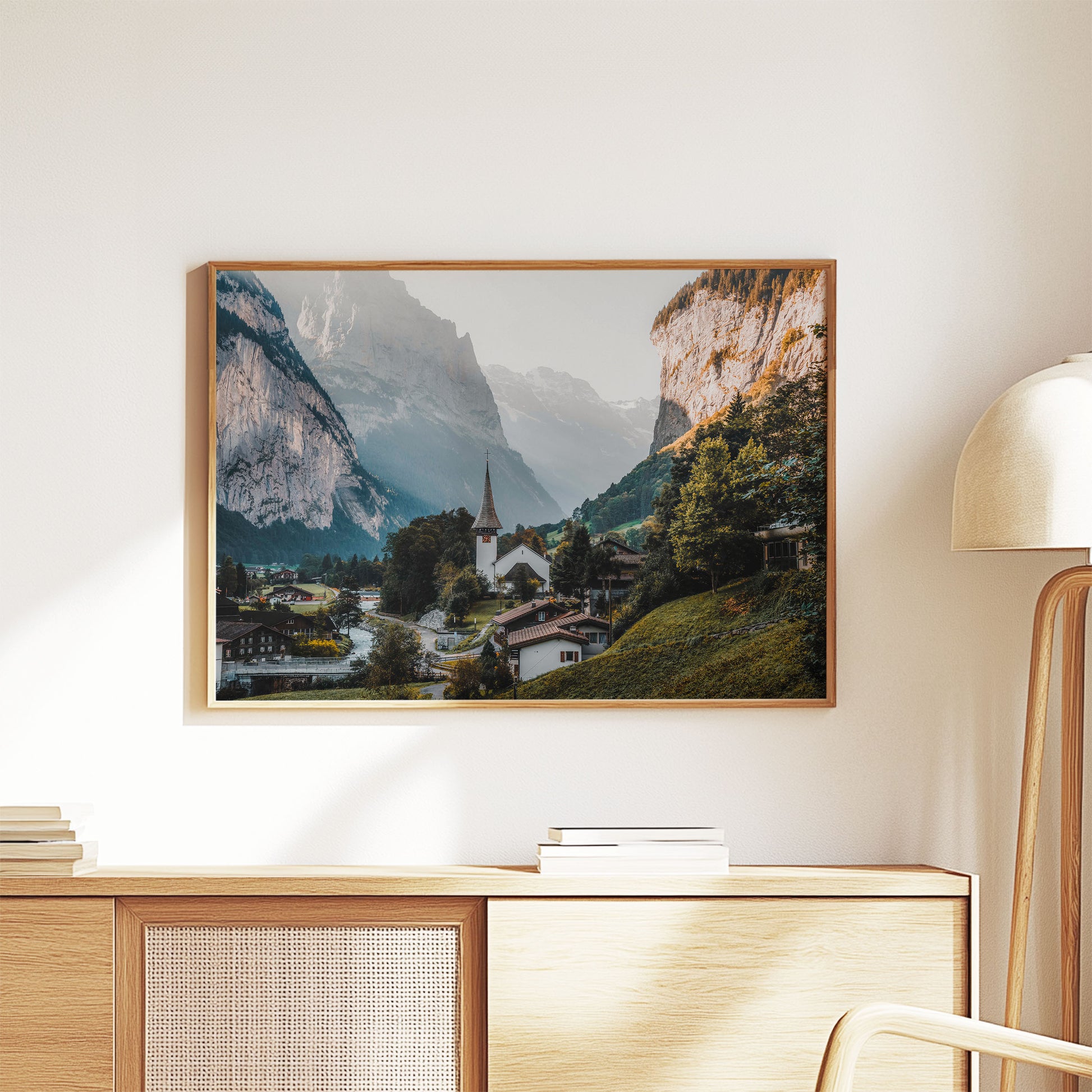 Swiss alpine village of Lauterbrunnen surrounded by cliffs and greenery, ideal for wall decor.