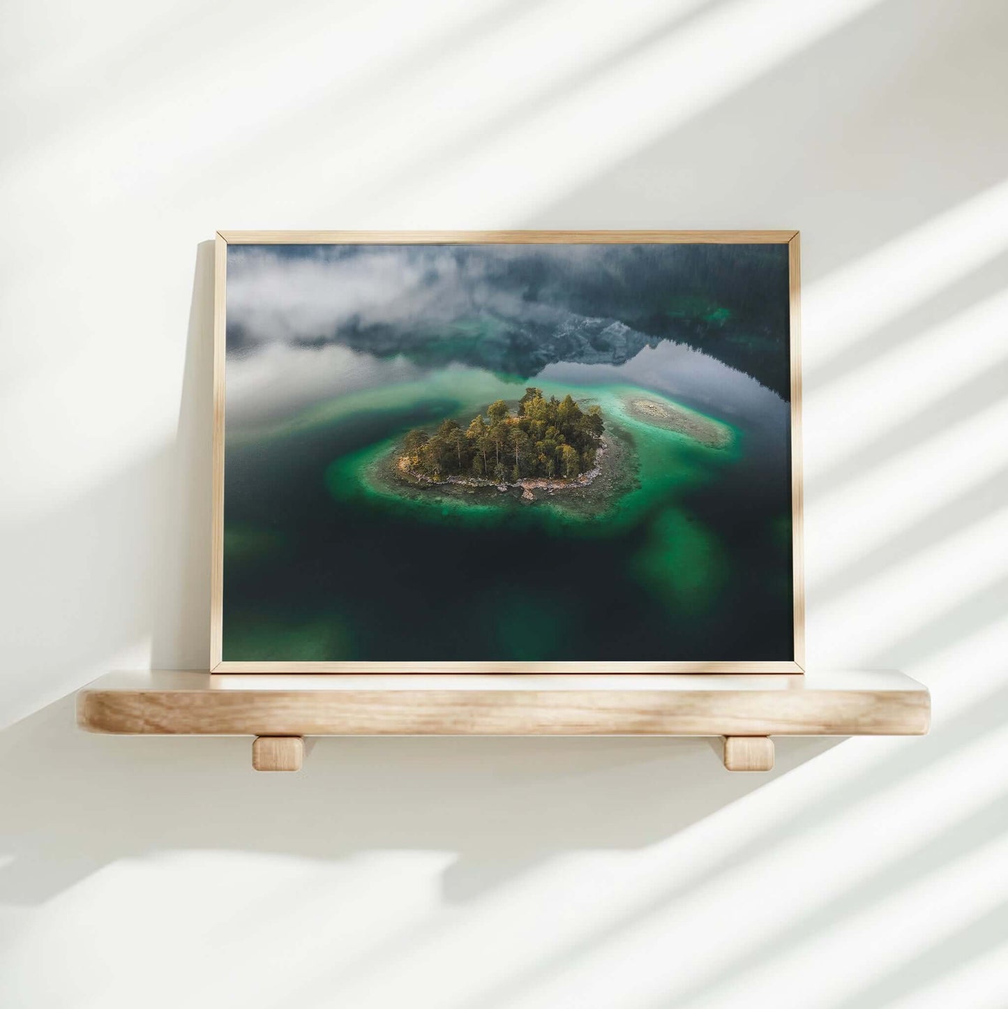 Minimalist mountain lake island floating in green-blue Eibsee water
