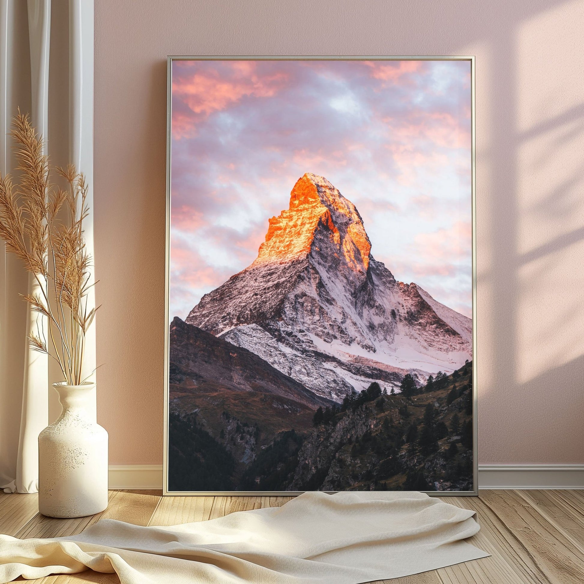 A stunning silver-framed image of the Matterhorn at dawn, set against glowing pink skies.