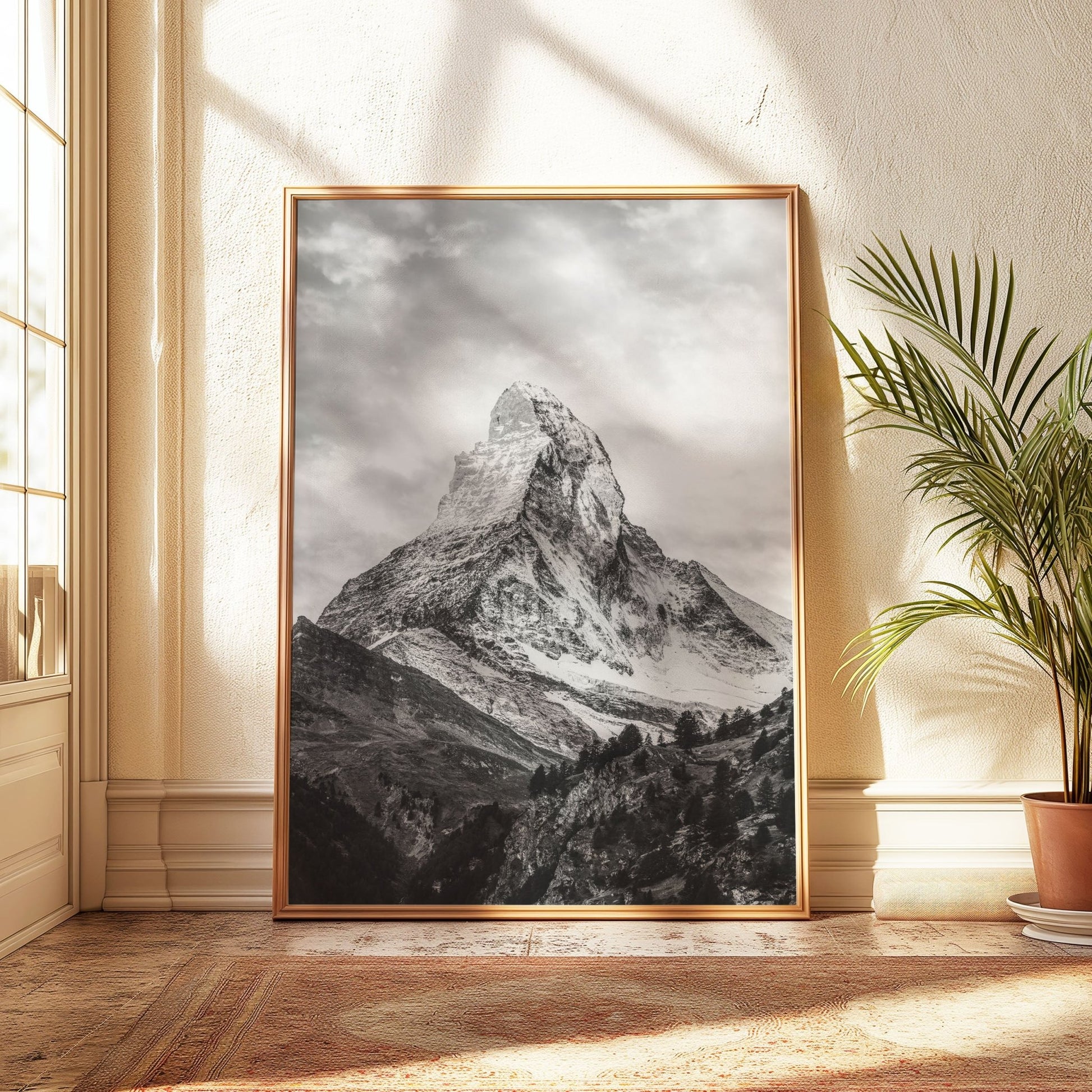 Elegant photo of the Matterhorn in a light gold frame, basking in warm natural light.