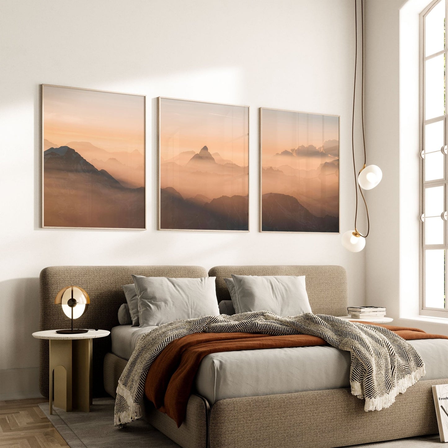 Set of three wall art prints showcasing the Matterhorn and Mont Blanc sunrise, styled above a modern bedroom.