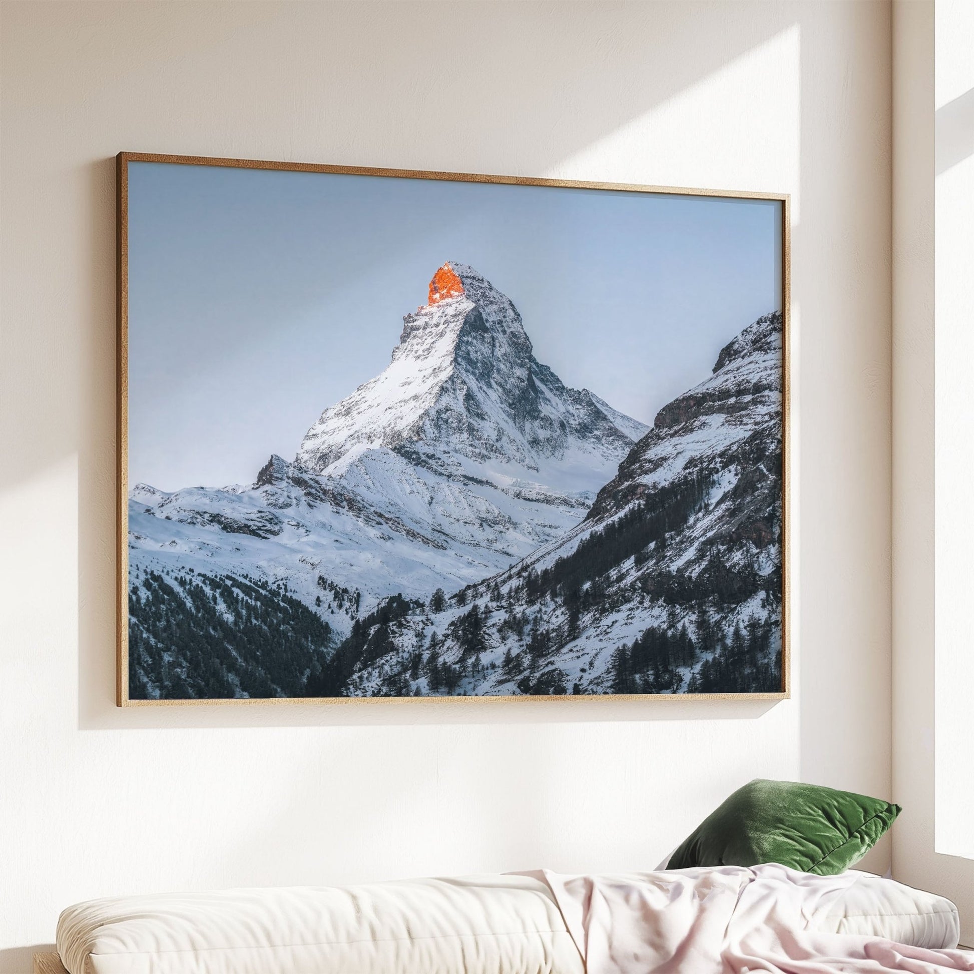 Dramatic view of the Matterhorn at dusk with snow-covered slopes.