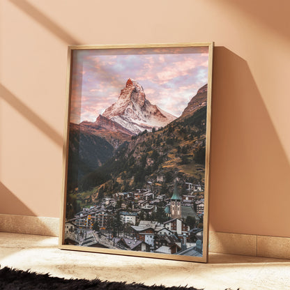 The Matterhorn and Zermatt village at dawn with pink skies, creating an inspiring nature wall art design for any space.