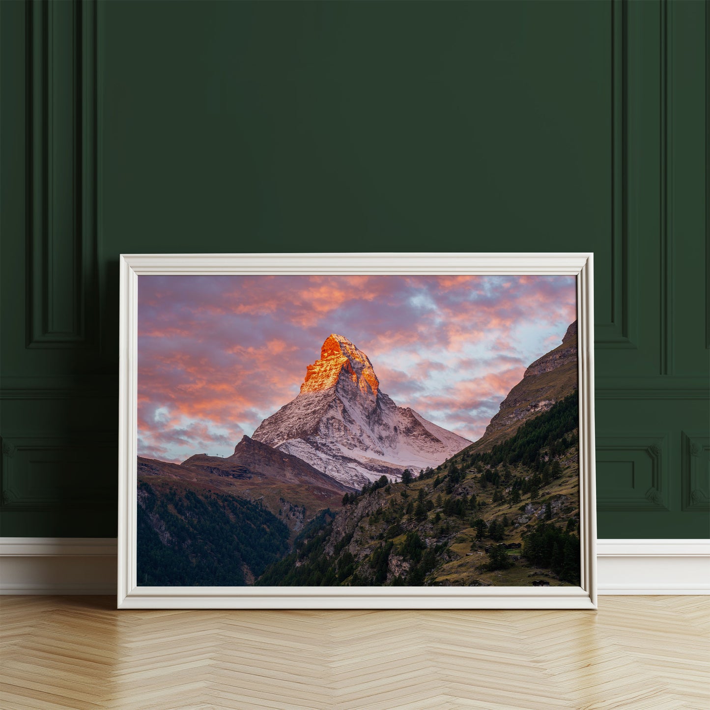 Framed Matterhorn mountain sunset wall art against deep green walls, creating a classic, timeless look