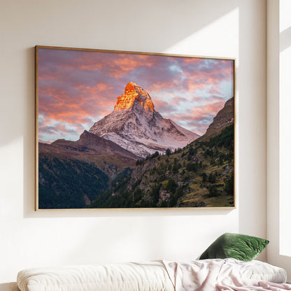 Matterhorn mountain sunset wall art displayed above a contemporary sofa, showcasing its majestic glow.