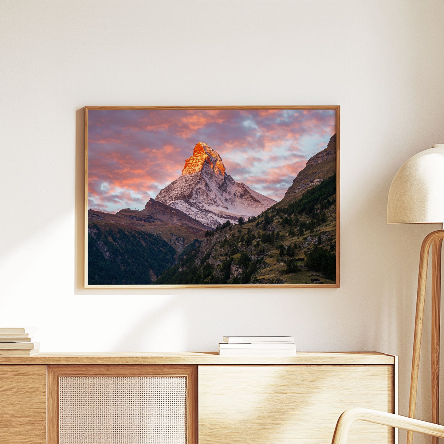 Elegant Matterhorn mountain sunset wall art hanging in a minimalist living space with warm, natural tones.