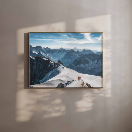 Framed wall art of two mountaineers descending the Midi Arête in Chamonix under a bright blue sky.