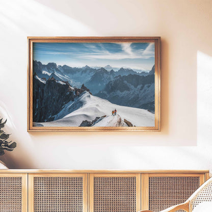 Two mountaineers on the snowy Midi Arête, framed artwork displayed in a cozy living space.