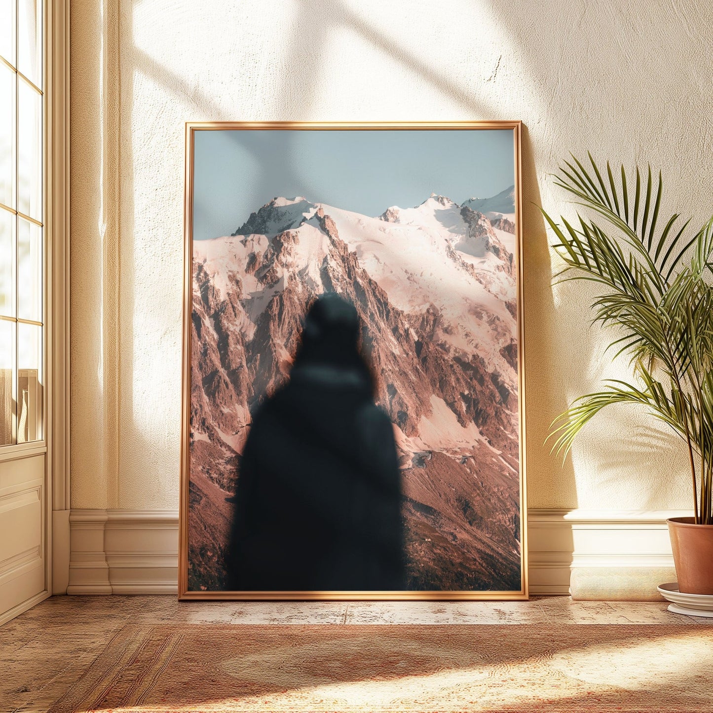 Framed artwork featuring a climber’s silhouette against the snowy Mont Blanc massif.