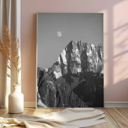 Mont Blanc's Grand Jorasses mountain with moon in a timeless black-and-white print.