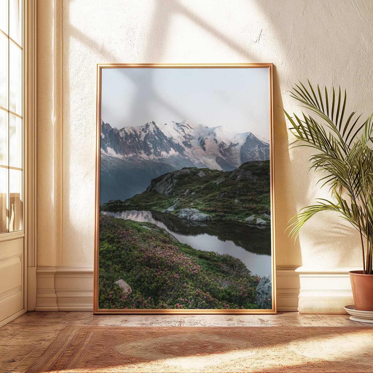 Serene scene at Lac de la Flégère with Mont Blanc in the background, framed by lush greenery.