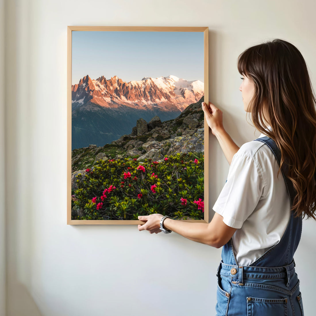 Majestic Mont Blanc Massif glowing at sunset with vivid alpine flowers in the foreground.