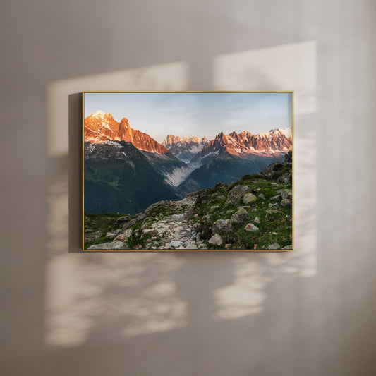 Chamonix wall art print of Mont Blanc massif sunset with a view of Mer de Glace, framed and hanging on a wall with light shadows.