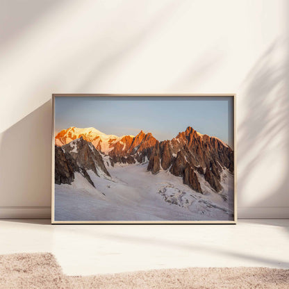 Dramatic sunrise illuminating Mont Blanc, Mont Maudit, and Mont Blanc du Tacul, an alpine photography wall print for your home.